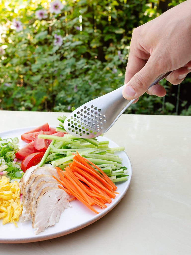 Sori Yanagi Perforated Tongs and a salad